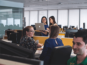 Teachers chatting in office